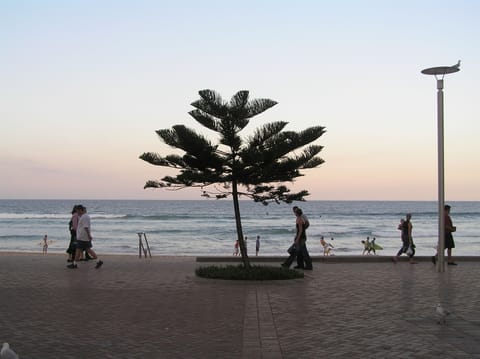 On the beach, white sand, sun loungers, beach umbrellas