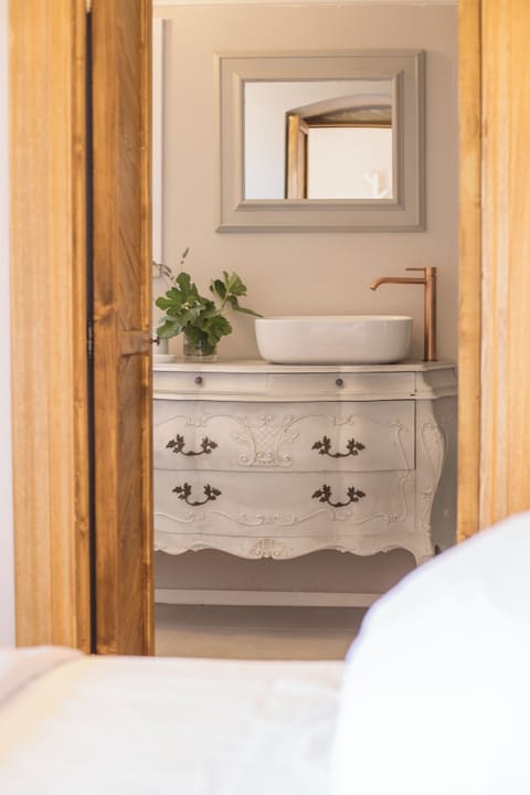 Comfort Room | Bathroom | Designer toiletries, hair dryer, bathrobes, slippers