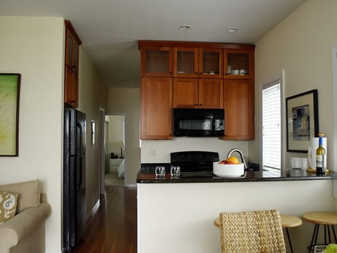 2 Bedroom Poolside Lower | Private kitchen | Full-size fridge, microwave, oven, stovetop