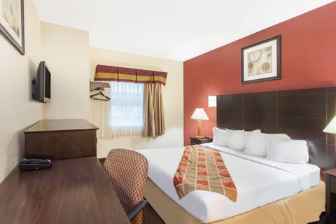 Room, 1 King Bed, Non Smoking | Desk, blackout drapes, iron/ironing board, free cribs/infant beds