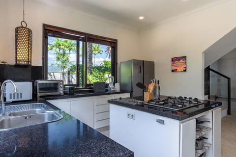 Electric kettle, highchair, cleaning supplies, paper towels