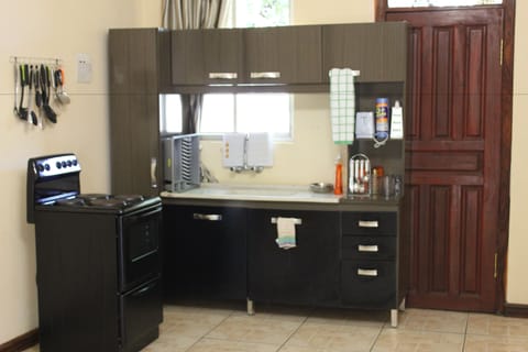 Family Room, 2 Bedrooms | Private kitchenette | Fridge, coffee/tea maker