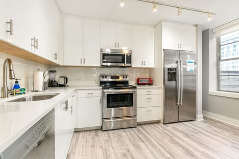 Exclusive Condo, 4 Bedrooms | Private kitchen | Full-size fridge, microwave, oven, stovetop