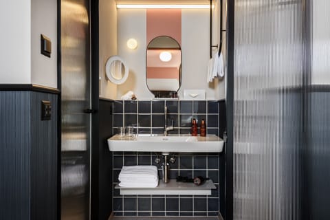 Shower, rainfall showerhead, designer toiletries, hair dryer