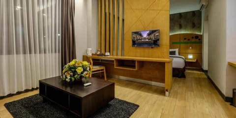 Suite Fabulous Room (Free Scheduled Airport Transfers) | Living room | Flat-screen TV