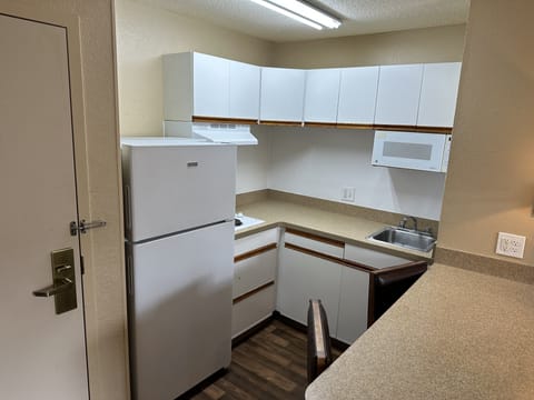 Fridge, microwave, stovetop, dining tables