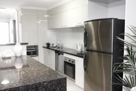 Executive Two Bedroom Ocean Front Apartment | Private kitchen | Full-size fridge, microwave, stovetop, dishwasher