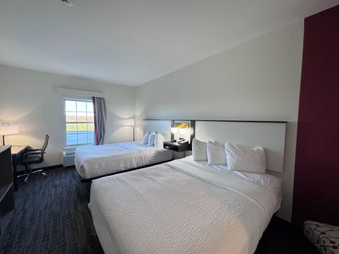 Desk, blackout drapes, iron/ironing board, rollaway beds