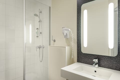 Shower, eco-friendly toiletries, hair dryer, towels