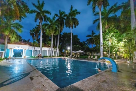 Outdoor pool, pool umbrellas, sun loungers