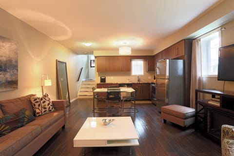 One-Bedroom Townhome - D | Living area | 50-inch LED TV with cable channels