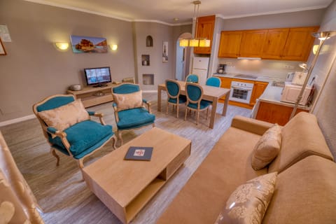 Comfort Apartment, 1 Bedroom | Living area | Flat-screen TV, DVD player