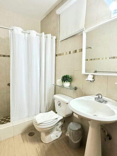 Standard room, 2 double beds with balcony | Bathroom | Shower, hair dryer, towels