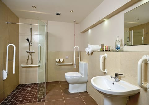 Suite, 1 King Bed, Balcony, Ground Floor | Bathroom | Designer toiletries, hair dryer, towels