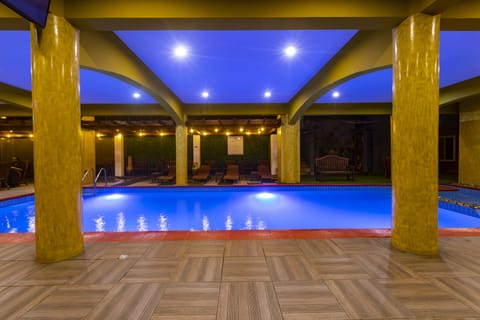 Indoor pool, outdoor pool, pool umbrellas, sun loungers