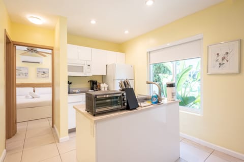 Comfort Apartment | Private kitchen | Full-size fridge, microwave, stovetop, electric kettle