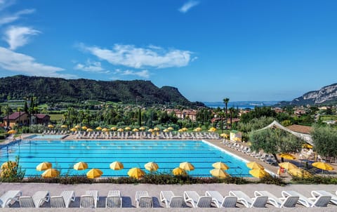 Seasonal outdoor pool, open 10:00 AM to 6:00 PM, pool umbrellas