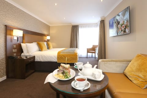 Suite, 1 King Bed, Non Smoking | 1 bedroom, desk, laptop workspace, iron/ironing board