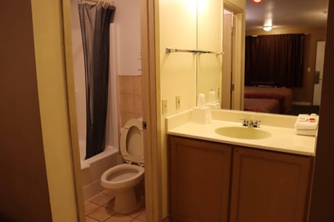 Standard Room, 2 Queen Beds | Bathroom | Combined shower/tub, deep soaking tub, free toiletries, towels