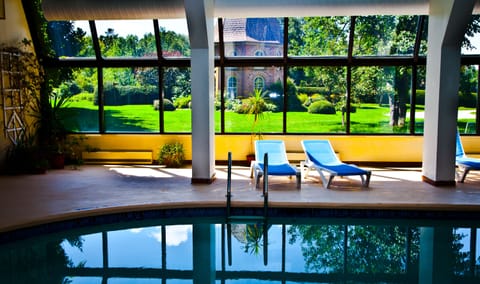 Indoor pool, pool umbrellas, sun loungers