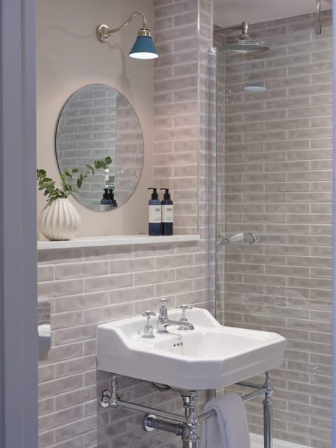 Comfort Loft | Bathroom | Designer toiletries, hair dryer, towels, soap