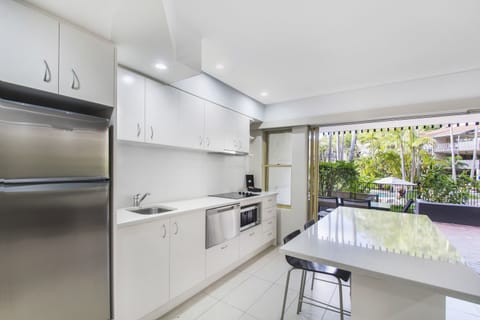 Two Bedroom Poolside Apartment | Private kitchen | Fridge, microwave, stovetop, coffee/tea maker