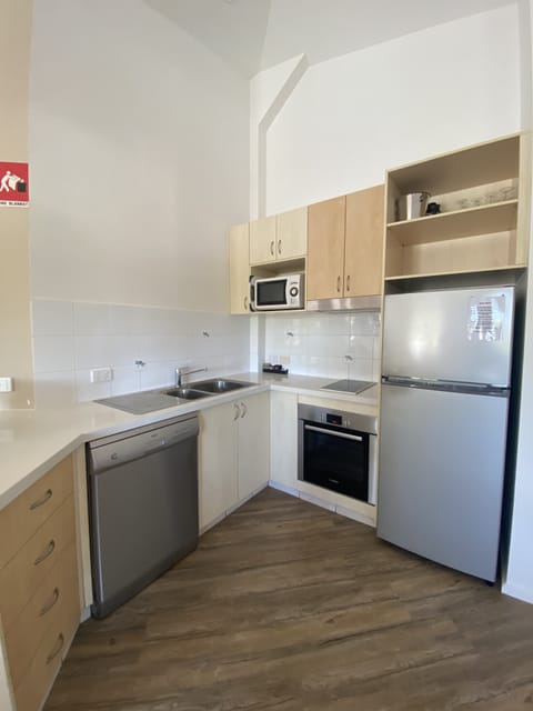 Apartment, 1 Bedroom, Street Side | Private kitchen | Fridge, microwave, electric kettle, cookware/dishes/utensils