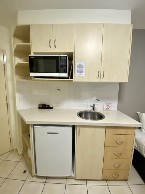 Fridge, microwave, electric kettle, cookware/dishes/utensils