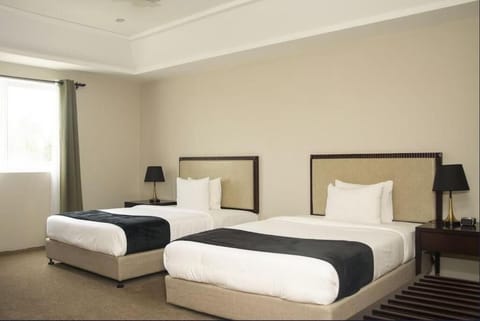 Deluxe Room, 2 Twin Beds | In-room safe, desk, iron/ironing board, free cribs/infant beds