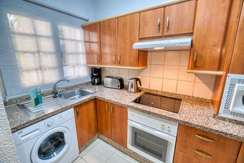 Apartment, 1 Bedroom | Private kitchen | Fridge, microwave, stovetop, coffee/tea maker