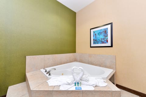 Suite, 1 King Bed, Jetted Tub | In-room safe, desk, iron/ironing board, free cribs/infant beds