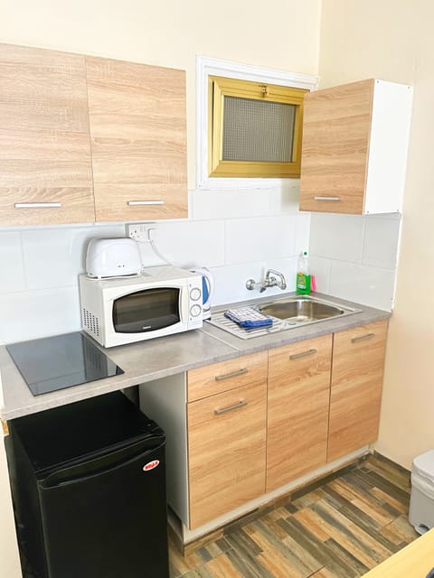 Apartment, 1 Bedroom, Garden View | Private kitchen | Mini-fridge, coffee/tea maker, cookware/dishes/utensils