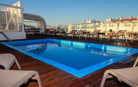 Outdoor pool, open 9:00 AM to 7:00 PM, sun loungers