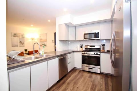 Two-Bedroom Suite with Balcony | Private kitchen | Full-size fridge, microwave, oven, stovetop