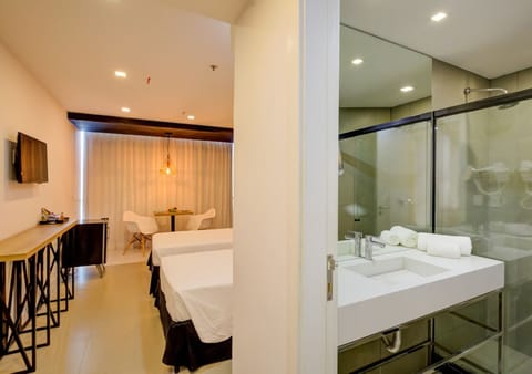 Junior Suite, 2 Twin Beds | Bathroom | Shower, free toiletries, hair dryer, towels
