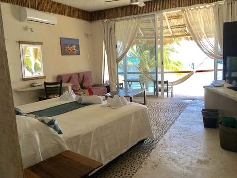 Romantic Suite, Beach View | Minibar, blackout drapes, soundproofing, free WiFi