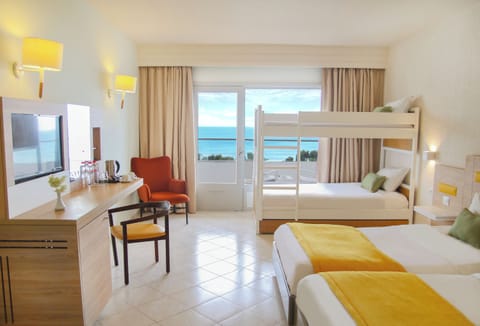 Family Room, Sea View | Minibar, in-room safe, blackout drapes, free WiFi