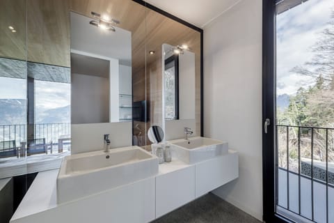 GUEST Suite #103 | Bathroom | Designer toiletries, hair dryer, bathrobes, slippers