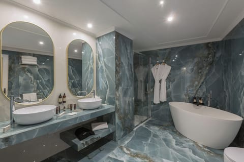 Executive Suite | Bathroom | Designer toiletries, hair dryer, bathrobes, slippers