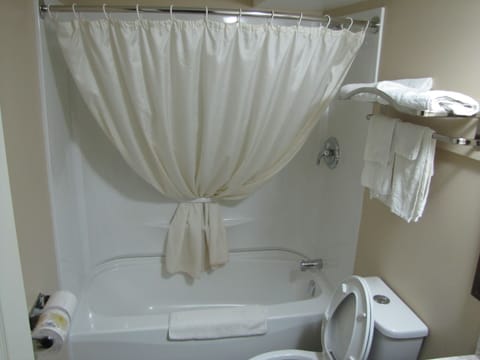 Standard Room, 2 Queen Beds with outside access | Bathroom | Combined shower/tub, hair dryer, towels