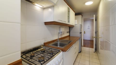 Family Apartment, 2 Bedrooms | Private kitchen | Microwave, toaster, cookware/dishes/utensils, dining tables