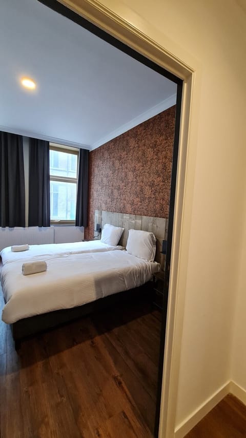 Basic Twin Room, 2 Twin Beds | Desk, iron/ironing board, free cribs/infant beds, free WiFi