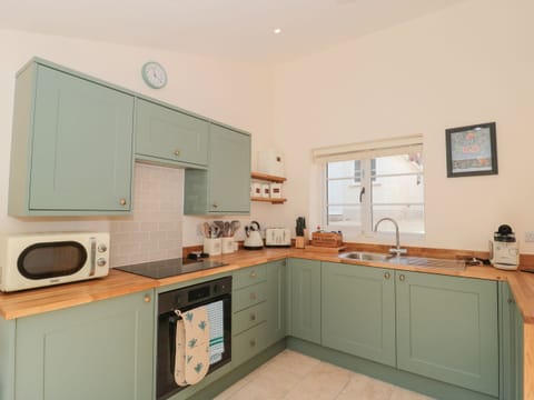 Fridge, electric kettle, toaster, cookware/dishes/utensils