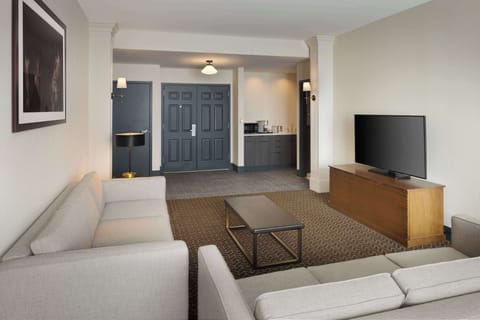 Two Room Hospitality Suite, 1 King Bed | Living area | 55-inch LED TV with digital channels, TV, MP3 dock