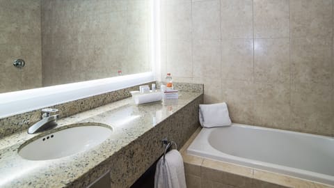 Suite, 1 King Bed (Bath and Walk-In Shower) | Bathroom | Shower, eco-friendly toiletries, hair dryer, towels