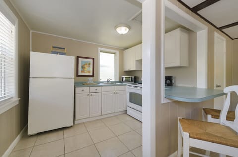 Two Bedroom Queen Cottage | Private kitchen | Full-size fridge, microwave, oven, stovetop