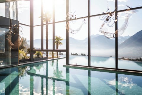 2 indoor pools, 2 outdoor pools, open 7:00 AM to 7:00 PM, pool umbrellas