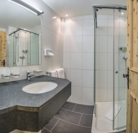 Economy Double Room Plus | Bathroom | Shower, hair dryer, slippers, towels