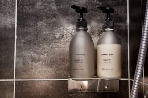 Shower, eco-friendly toiletries, hair dryer, towels