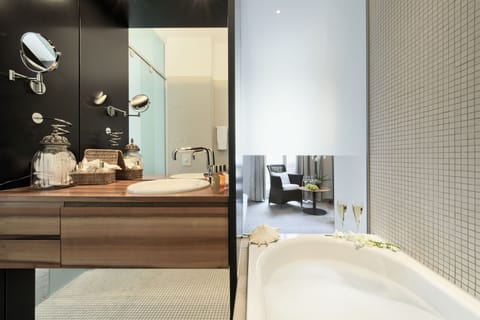 Double room Deluxe with Balcony(Limmathof Baden Hotel & Novum Spa Limmatpromenade 28, CH-5400 Baden) | Bathroom | Deep soaking tub, free toiletries, hair dryer, bathrobes